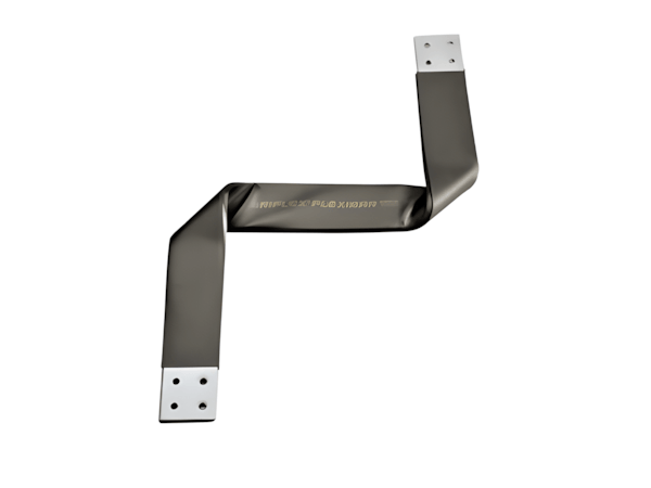 Whitney leaning against a railing on a downtown street