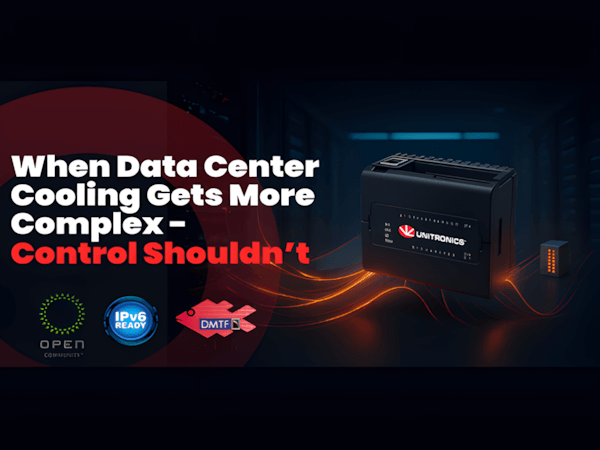 Whitney leaning against a railing on a downtown street